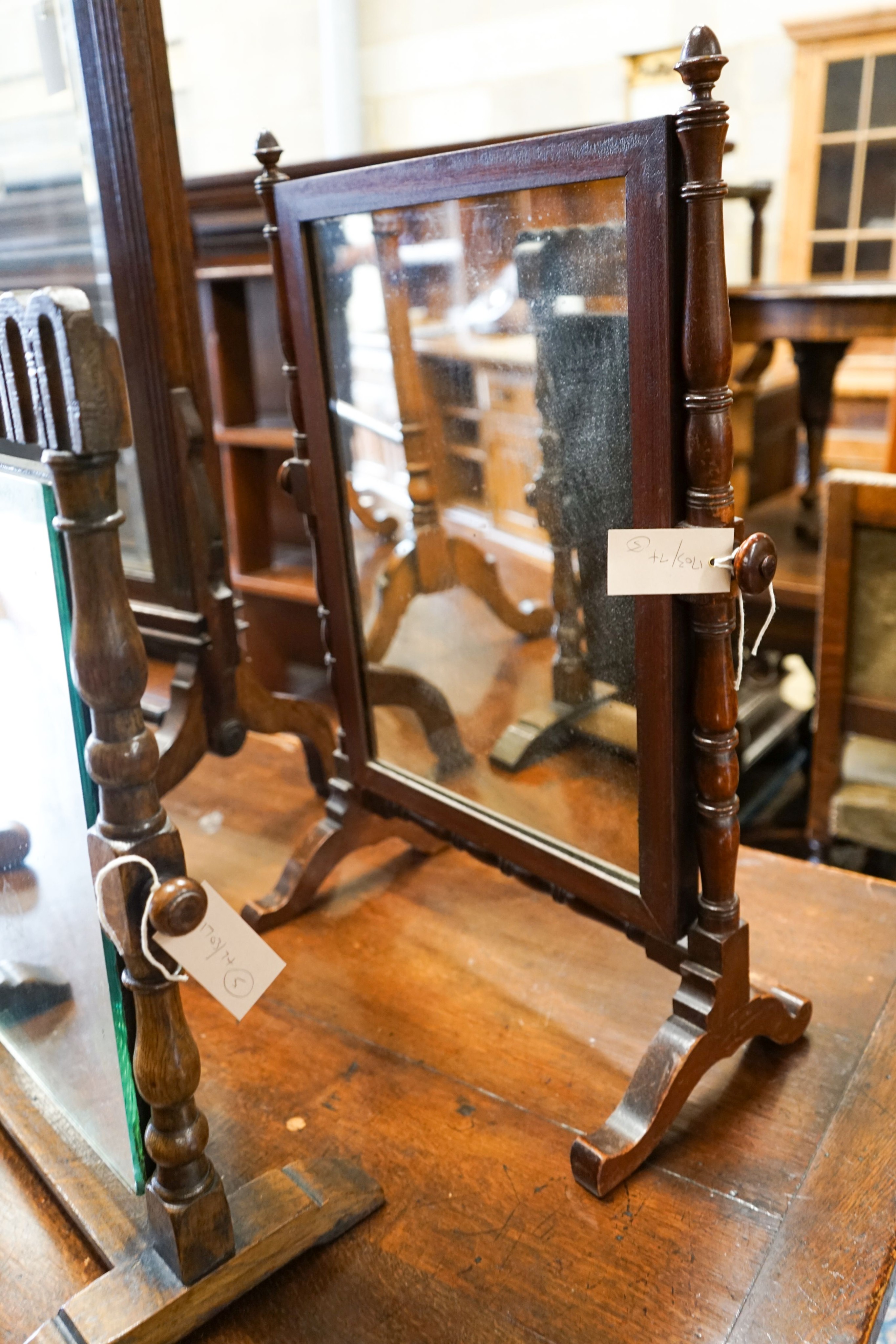 An oak triple mirror, a towel rail, an oak firescreen and two toilet mirrors